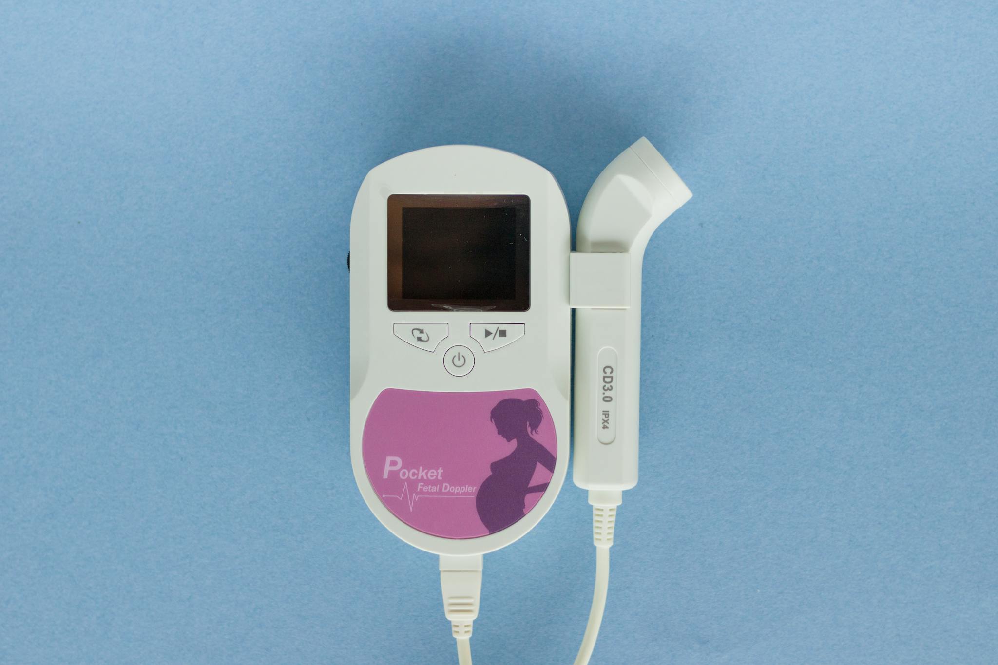 Close-up of a handheld Doppler fetal monitor used for prenatal care.